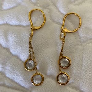 Gold colored drop earrings with crystals
